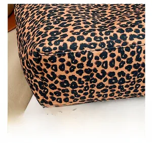 Close-up of leopard print tote bag fabric texture and precise stitching detail