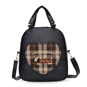 Retro black leather backpack featuring heart-shaped plaid cutout and cartoon puppy embroidery