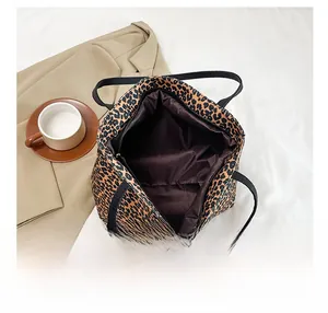 Top view of leopard print tote bag interior showing dark lining and zip closure