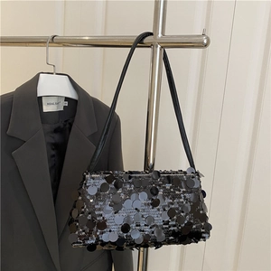 Fashionable black sequin shoulder bag for women with shiny metallic texture and leather strap