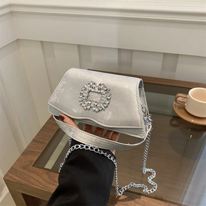 Elegant silver square satin handbag with sparkling crystal buckle and silver chain strap