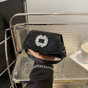 Elegant black square handbag with rhinestone buckle and silver chain strap