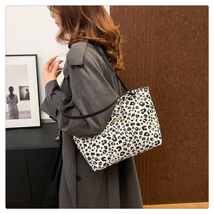 Fashionable leopard print tote bag shown on model for style and size reference