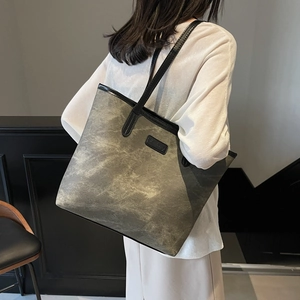 Large taupe tote bag with vintage marble texture and black leather trim for commuting