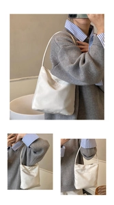 Detail view of the Hope and future embossed text on this stylish white nylon shoulder bag