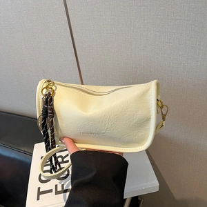 Minimalist beige leather shoulder bag with woven strap and fashion embossed lettering