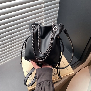 Minimalist black faux leather bucket bag with silver chain and Fashion & Bags text