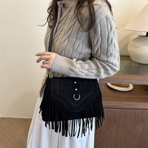 Bohemian style black suede fringe crossbody bag with gold D-ring and metal rivets