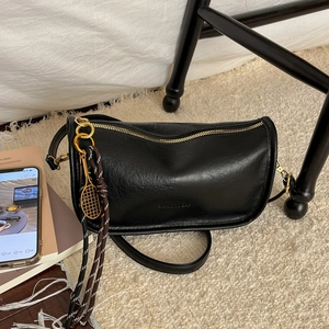 Retro black PU crossbody bag with golden tennis racket charm and braided strap