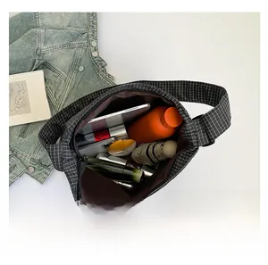 Interior view showing the large capacity of the black and white grid canvas tote bag