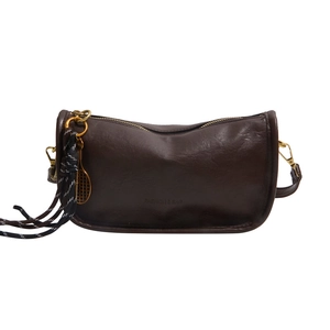Retro dark brown leather crossbody bag with vintage oil finish and tennis racket charm