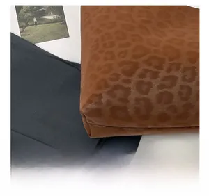 Detailed close-up showing the leopard print faux fur texture and precise stitching of the bag
