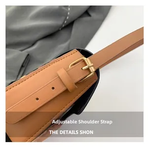 Detail of brown leather strap with golden adjustable buckle and multiple sizing holes