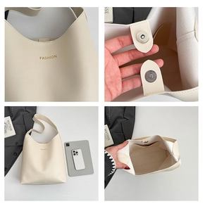 Detail view of cream PU leather tote bag with magnetic clasp and internal storage capacity
