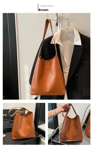 Close-up of vintage brown tote bag with gold FASHION text and large capacity design