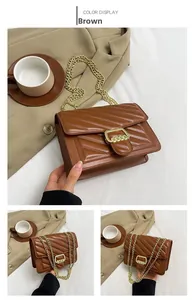 Detail view of brown PU leather crossbody bag with V-shaped quilting and gold metal chain
