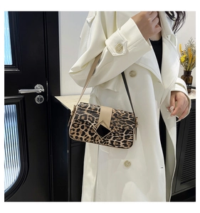 Detailed view of leopard print shoulder bag with diamond metal buckle and leather strap