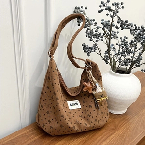 Brown corduroy hobo bag with bow heart prints and cute bear charm for daily use