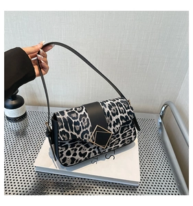Close-up of leopard print shoulder bag with geometric metal buckle and fine PU leather