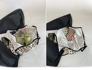 Detailed interior of polka dot canvas tote bag showing multiple storage pockets