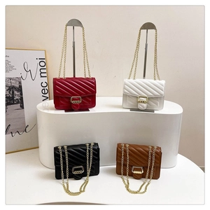 Detailed display of four elegant quilted leather chain bags in red white black and brown
