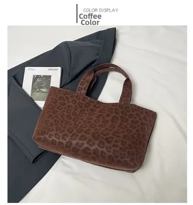 Macro detail of high-capacity coffee leopard print tote bag with stylish fuzzy texture