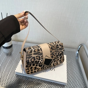 Chic leopard print shoulder bag with metallic buckle closure and leather strap