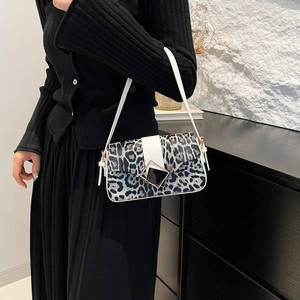 Fashionable leopard print shoulder bag with white leather strap and geometric metal buckle