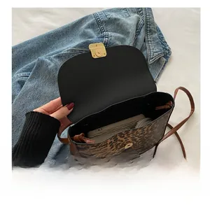 Leopard print crossbody bag interior showing spacious capacity for phone and wallet