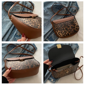 Detail shots of leopard print saddle bag with gold buckle and lychee grain leather finish