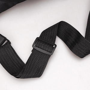 Detail of high-density nylon strap and adjustable buckle on the black chest bag