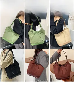 Multiple views of large capacity shoulder tote bags with bow detail in various colors