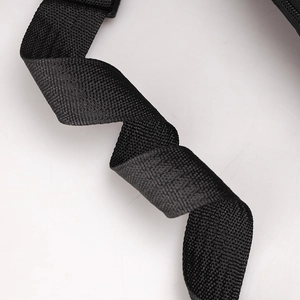 Detailed macro shot of the durable black woven nylon strap with cross-texture finish