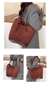 Detail view of large burgundy suede tote bag with drawstring closure for daily fashion