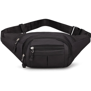 Detail view of black nylon outdoor chest bag showing multiple zipper compartments and buckles