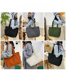 Detail showing various colors of large capacity corduroy tote bags on models