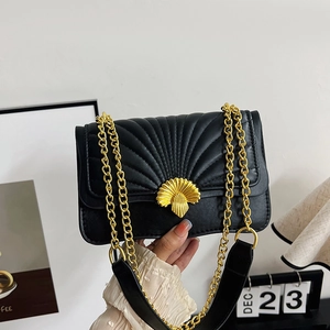 Chic black quilted crossbody bag with golden shell lock and chain strap for women