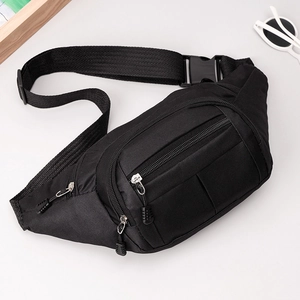 Detail of black tactical chest bag showing durable nylon texture and adjustable buckles
