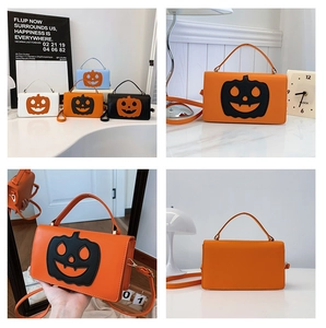 Detail view of pumpkin face small square bags in orange, blue, black and white colors