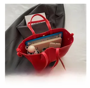 Macro shot showing large storage capacity of a red lychee texture tote bag