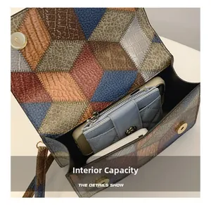 Detail view of the spacious inner compartment with patchwork texture and magnetic snap