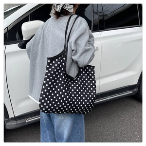 Large capacity canvas tote bag with white polka dots on black background for daily use