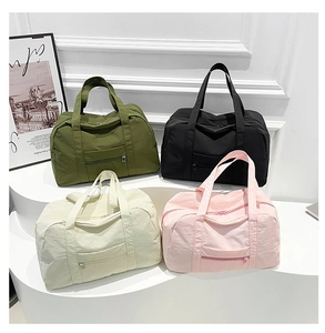Four colors of nylon travel bags shown on white display stands with minimalist decor