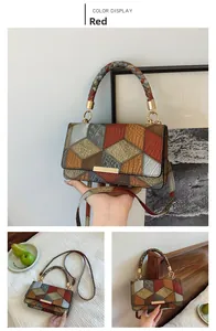 Detailed close-up of colorful patchwork shoulder bag with textured leather and metal hardware