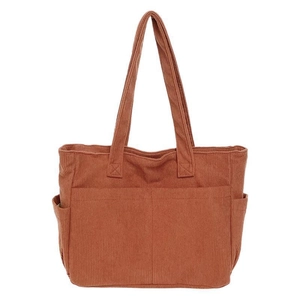 Large corduroy tote bag in rust red with front pockets for autumn and winter commute