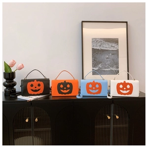 Funny pumpkin face crossbody bag in black orange blue and white faux leather