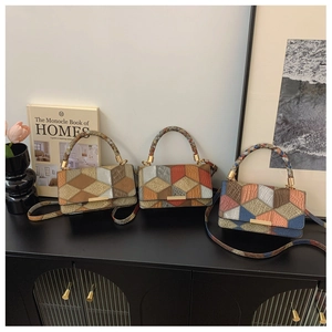 Detailed view of three vintage patchwork handbags with faux exotic textures and metal buckles