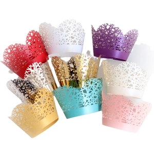 Laser cut cupcake wrappers in multiple pearlescent colors with elegant filigree design