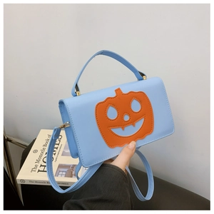 Funny light blue crossbody bag with orange pumpkin smiley face and handle strap