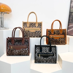 Chic leopard print tote bags in multiple colors with structured design and metal zippers